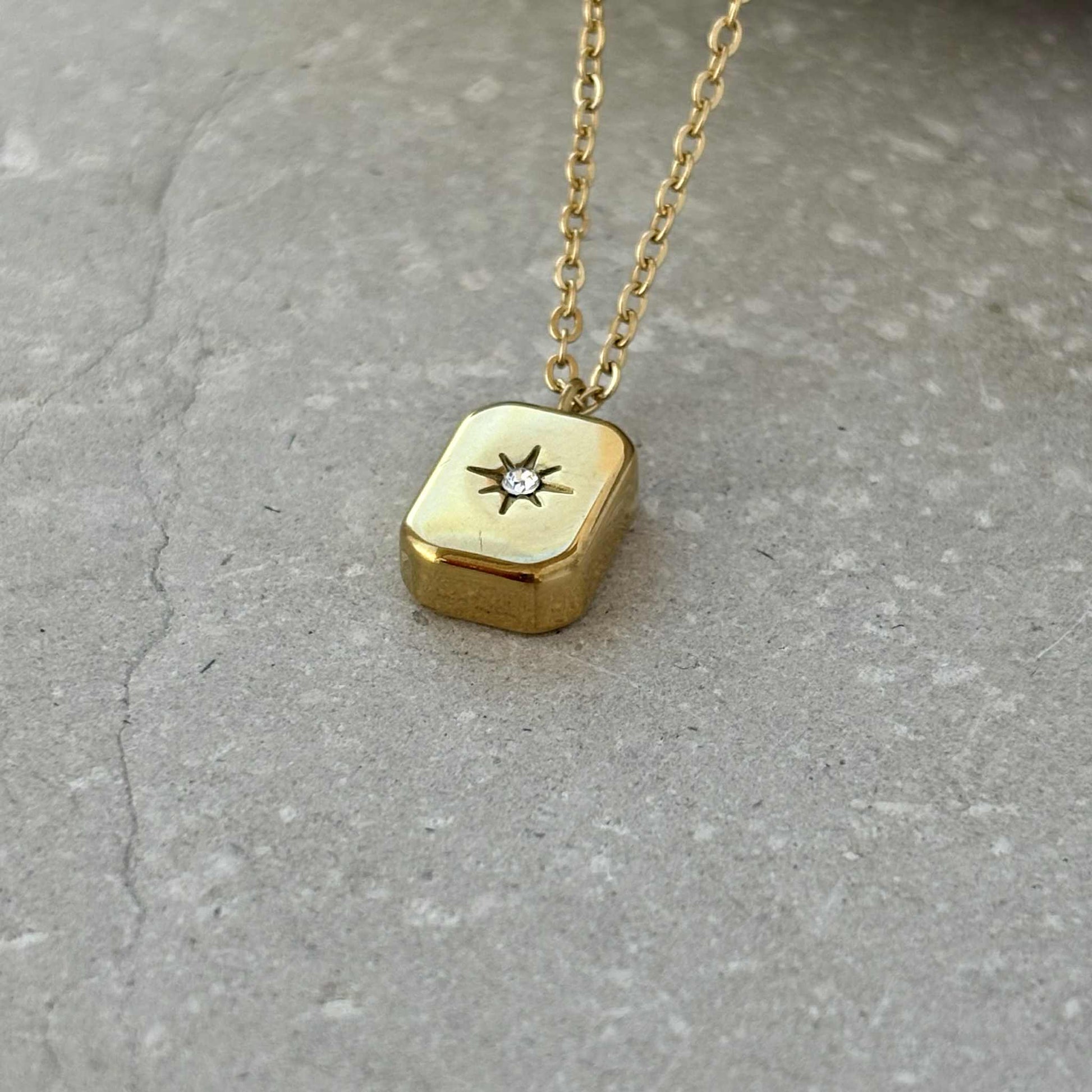 Gold block necklace detail