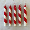 Red and white candy cane candles detail