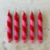 Red and pink candy cane candles detail