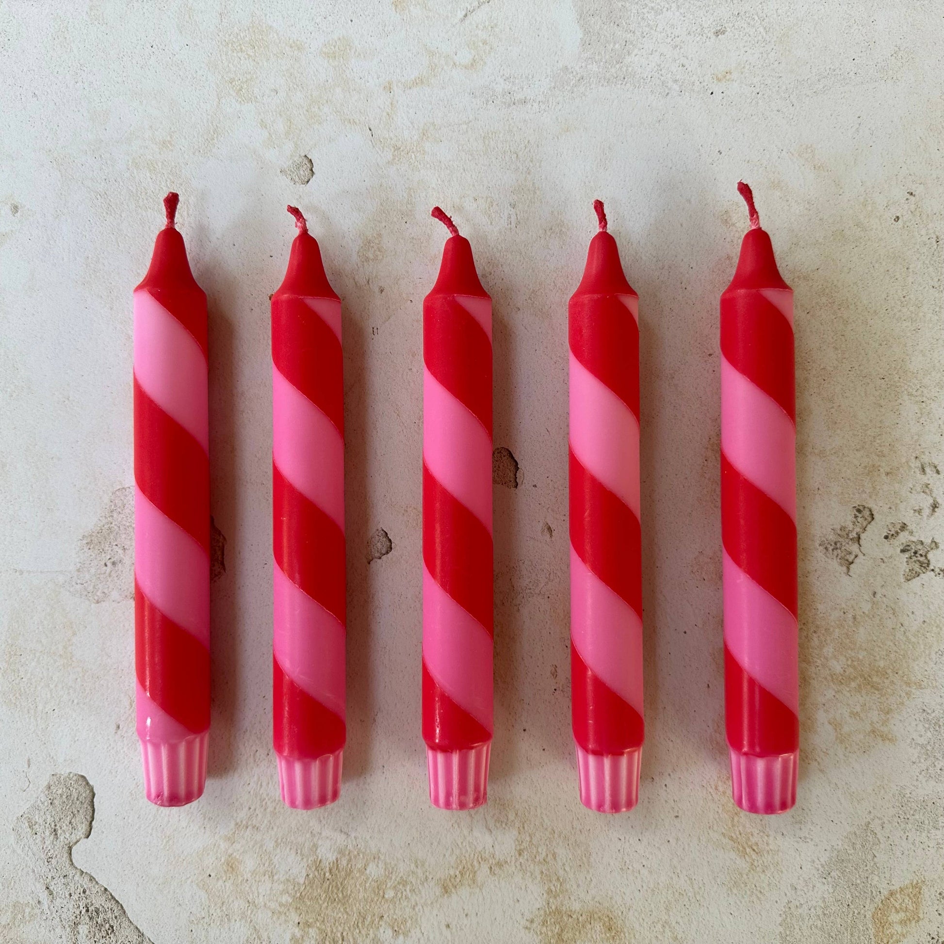 Red and pink candy cane candles detail